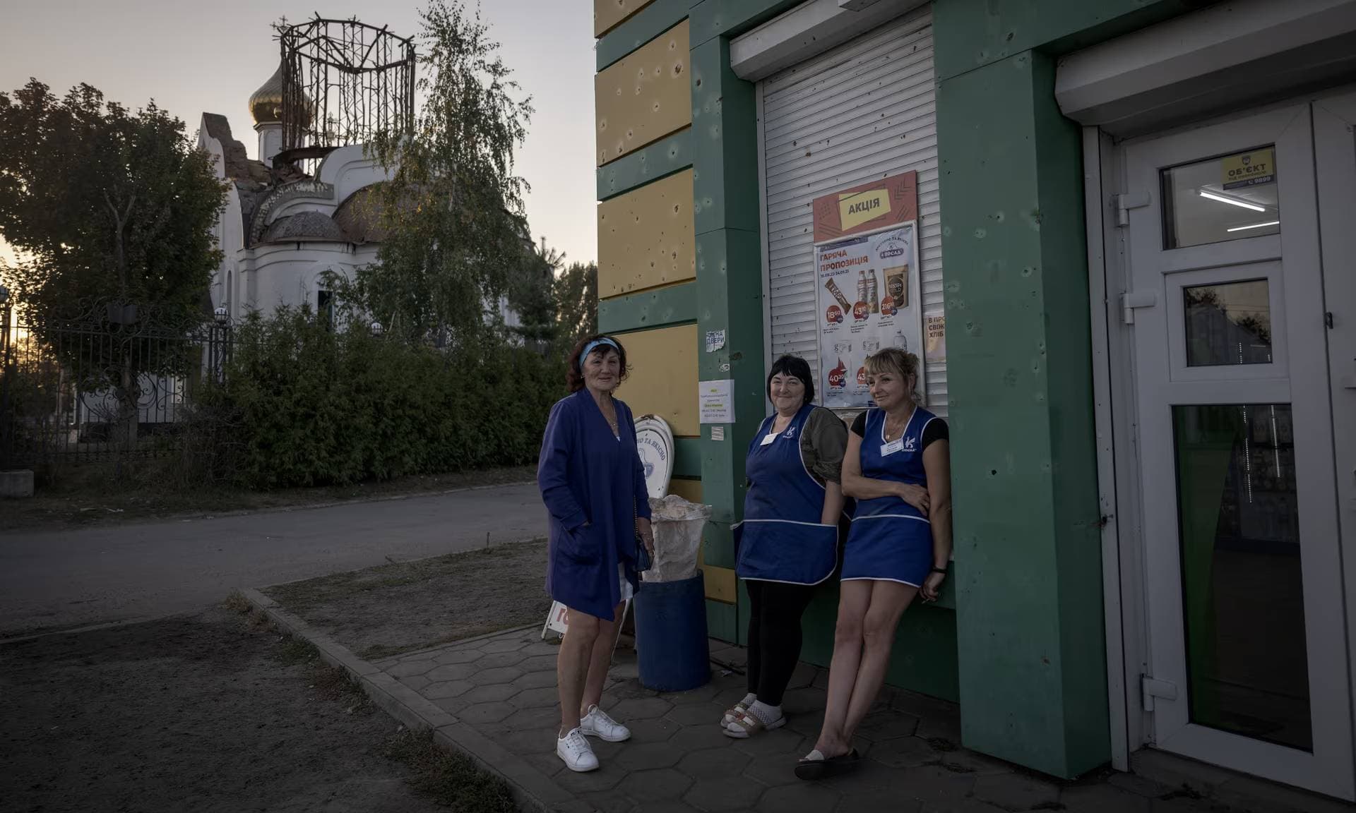 Sales Woman near a grocery store in the Staryi Saltiv town