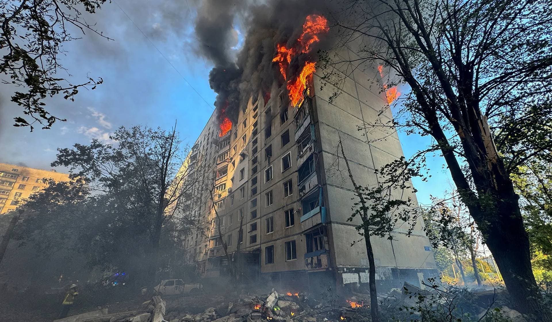 A burning apartment building hit by a Russian air strike in Kharkiv