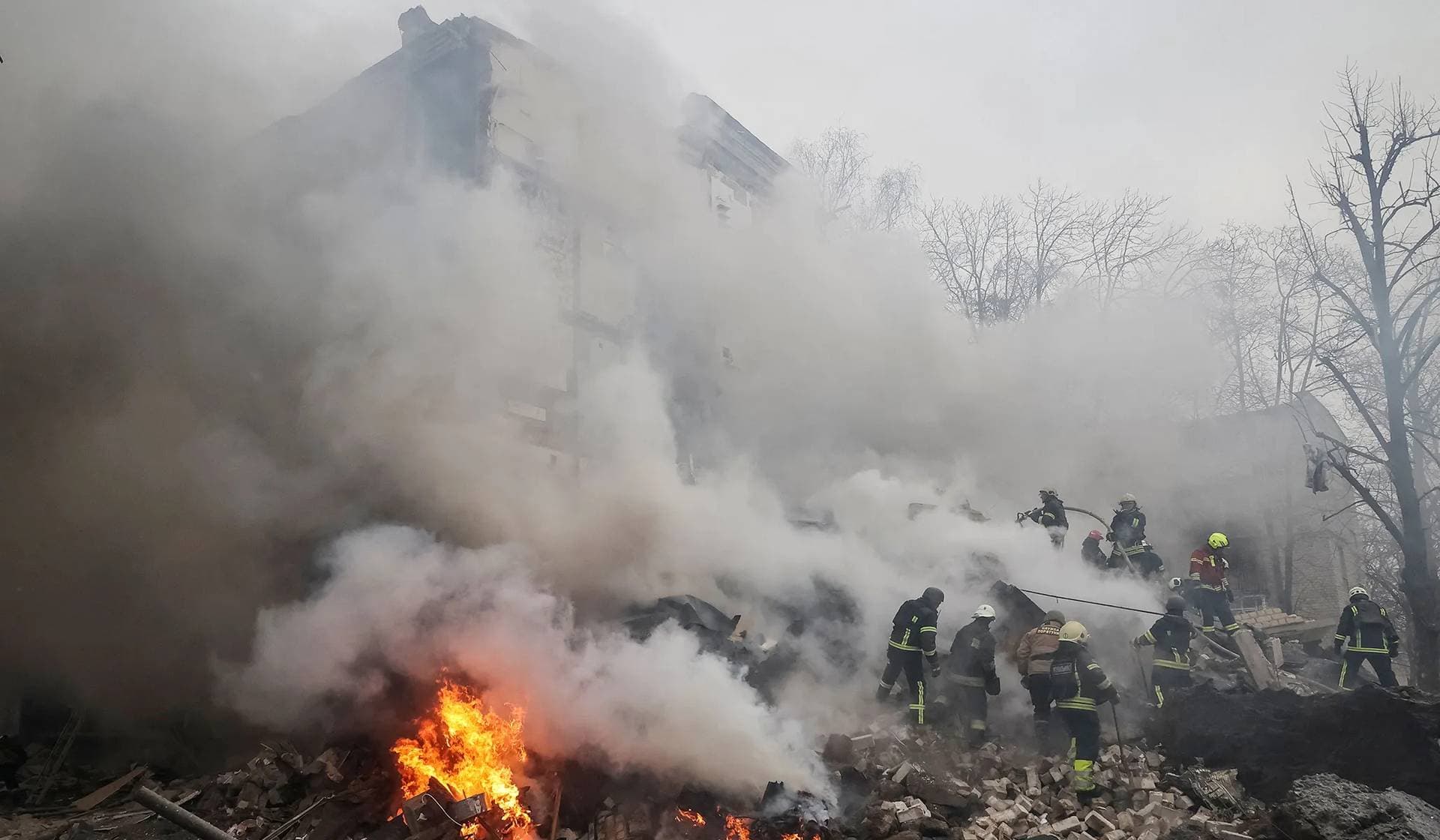 Rescuers work at a site of a residential building heavily damaged during a Russian missile attack in Kharkiv