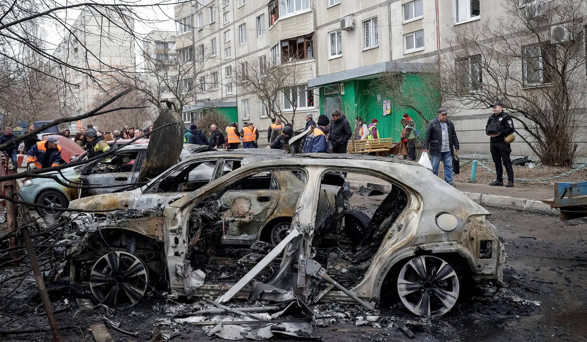 Destroyed vehicles at the site of a Russian drone strike in Kharkiv