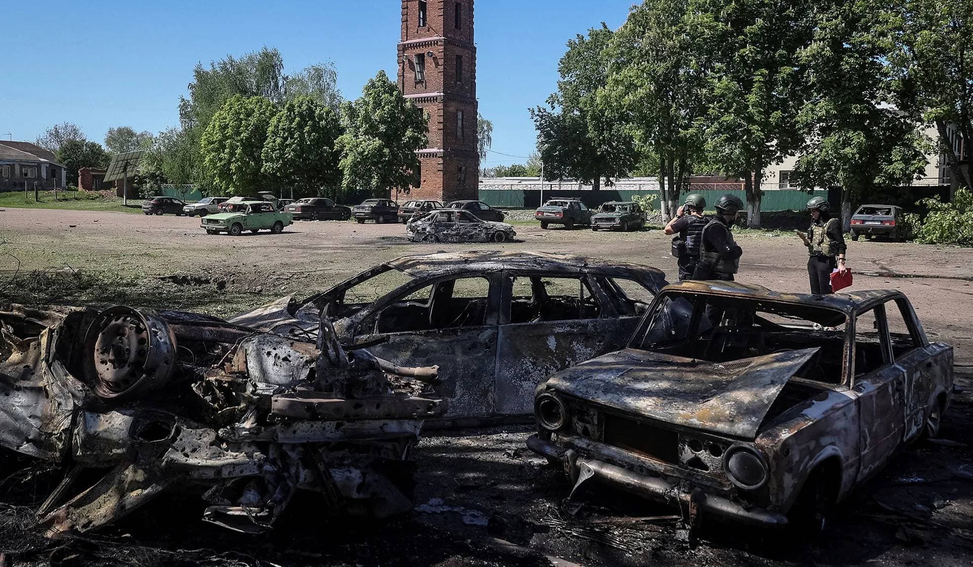 Police work at a site of a Russian missile strike in the village of Zolochiv in Kharkiv Region