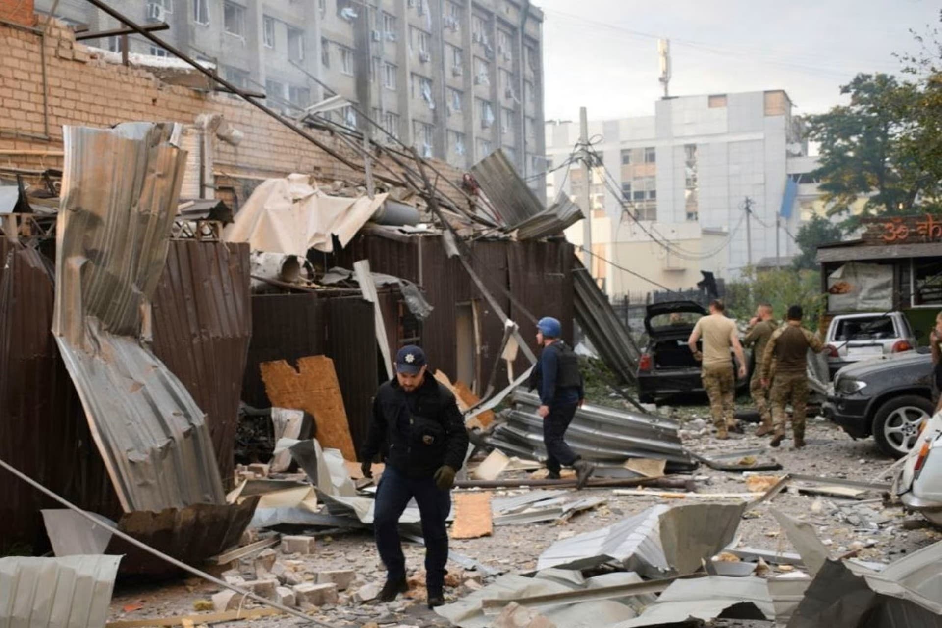 Police officers in front of the RIA Pizza restaurant destroyed by a Russian attack in Kramatorsk