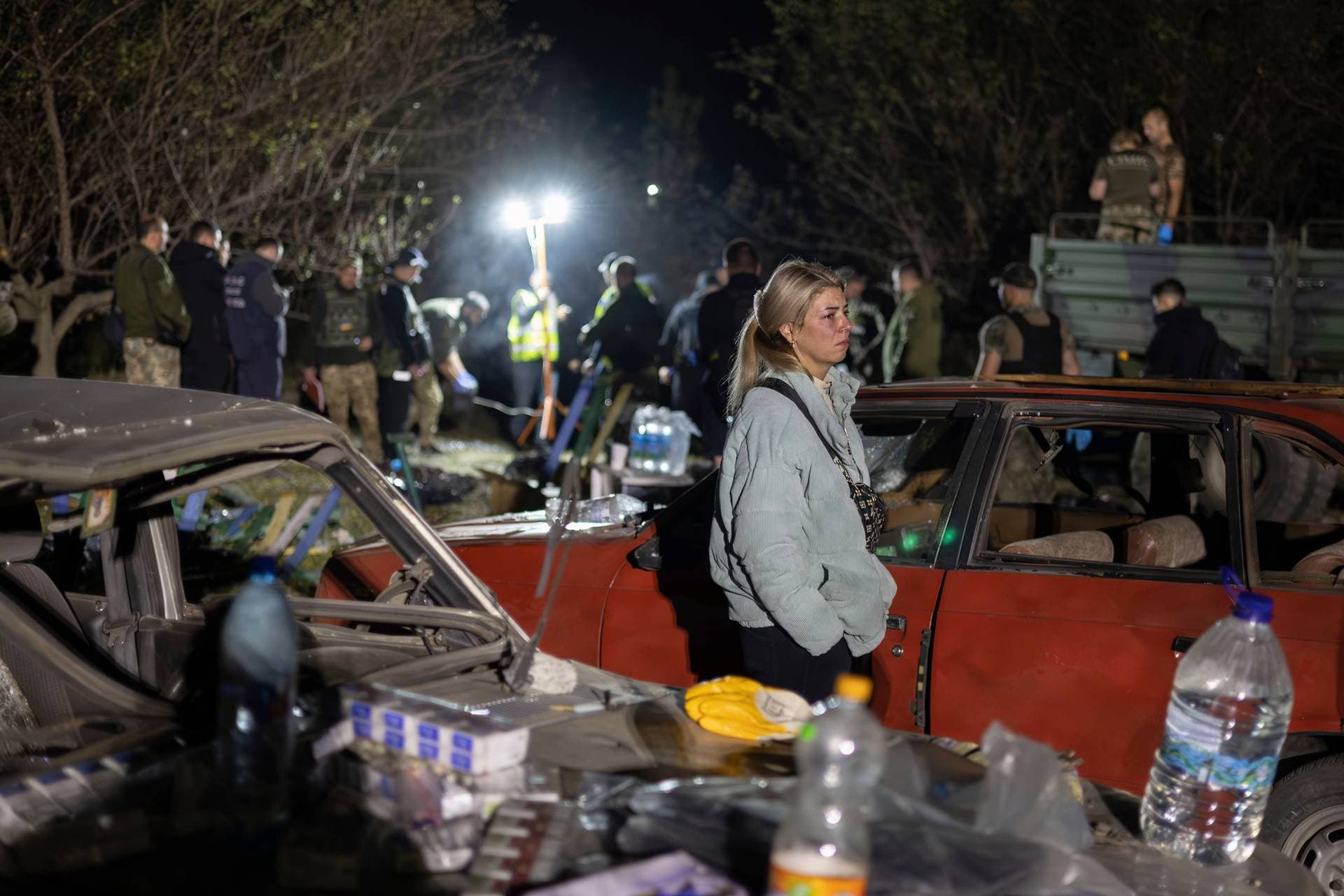 Lida Nechvolot, who lost her step-father reacts at the place of a Russian rocket attack in the village of Hroza