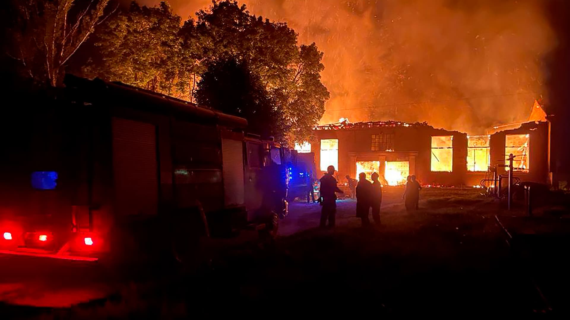 Smoke and flames rise after a Russian-guided aerial bomb hit a blood-transfusion center in the town of Kupyansk