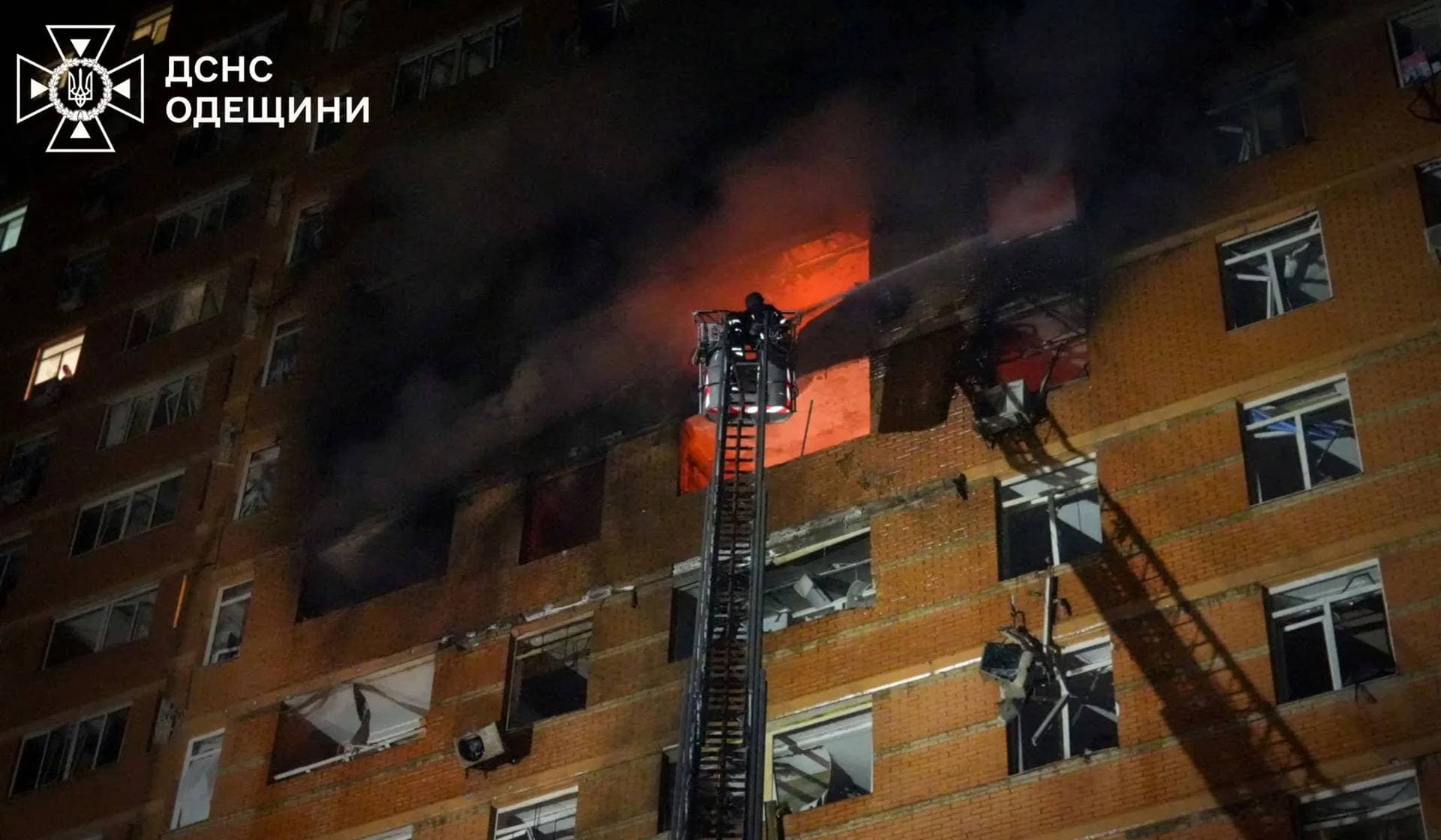 A firefighter works at the site of an apartment building hit by a Russian drone strike in Odesa