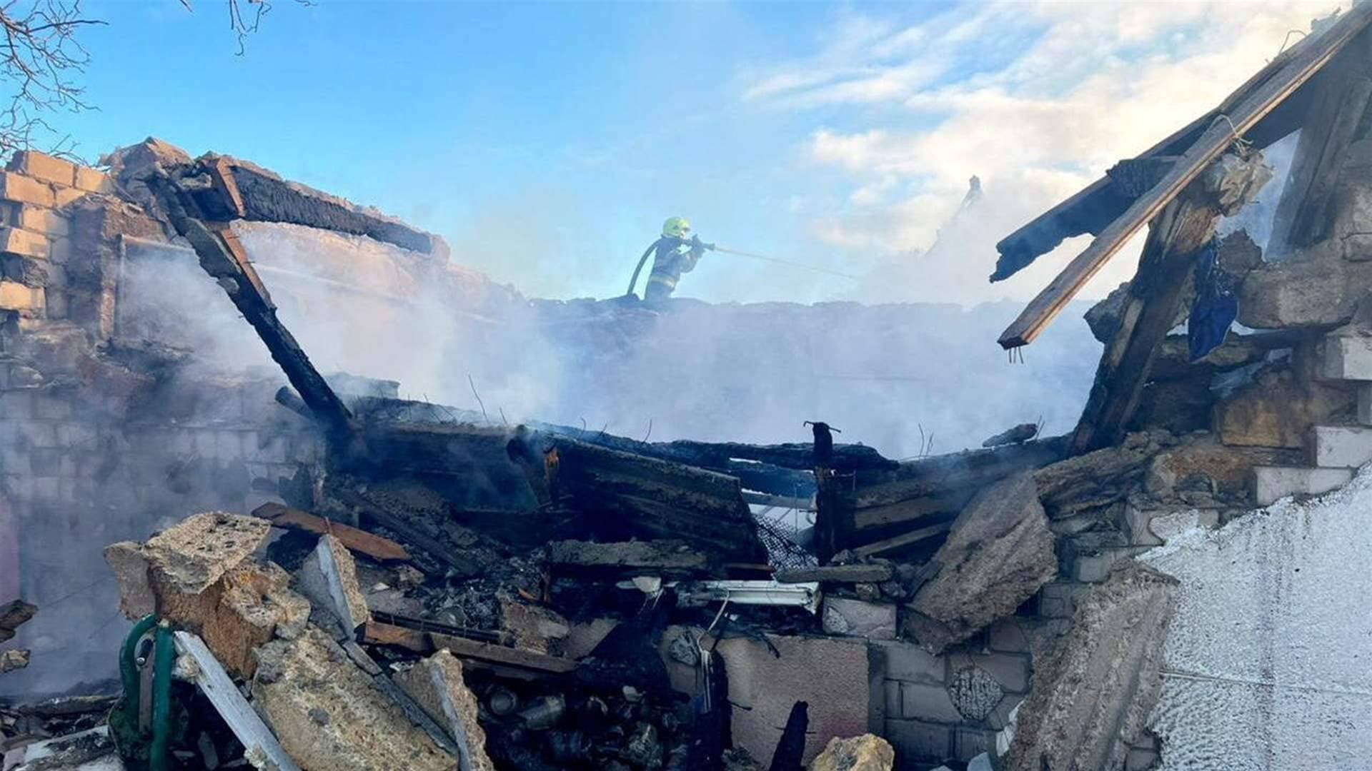 A firefighter works at the site of a Russian missile and drone strike in Odesa Region
