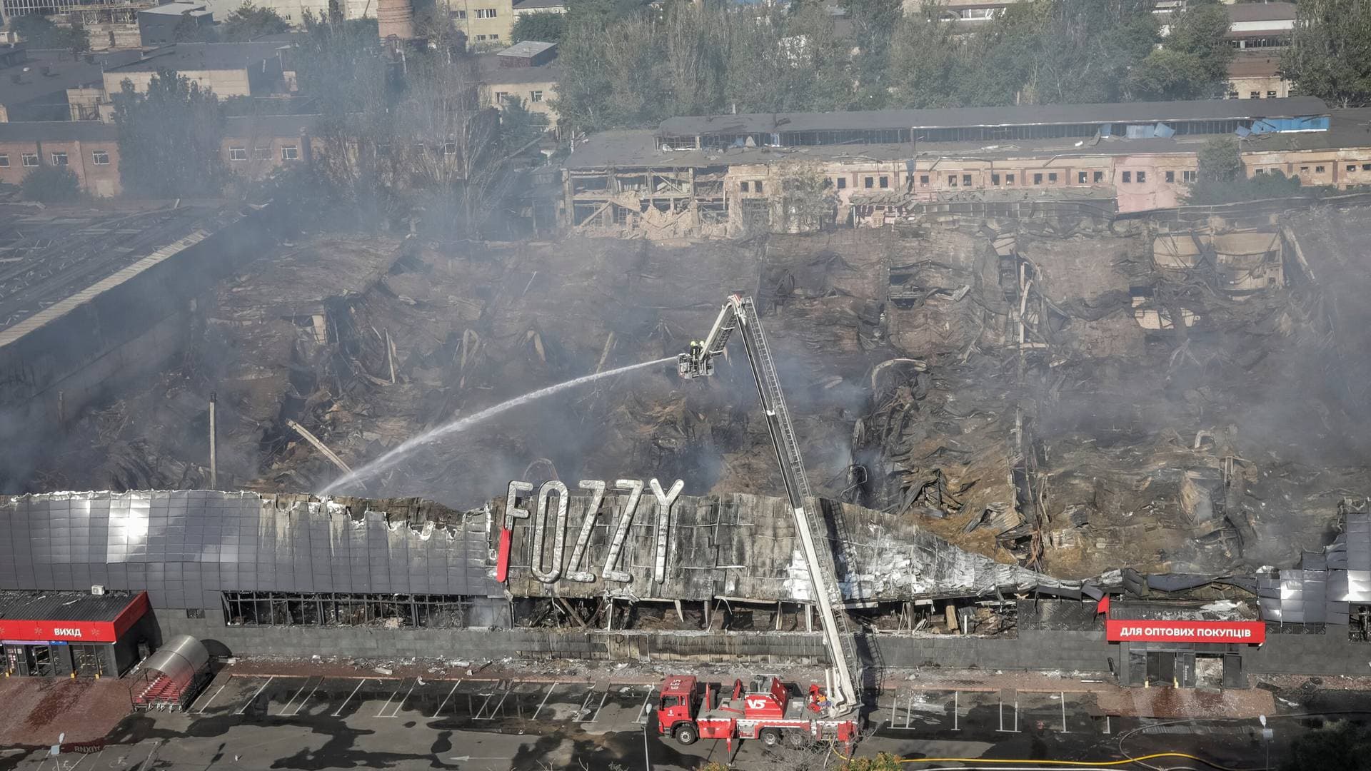 Rescuers work at a site of a shopping mall destroyed during a Russian military strike, amid Russia's attack on Ukraine, in Odesa