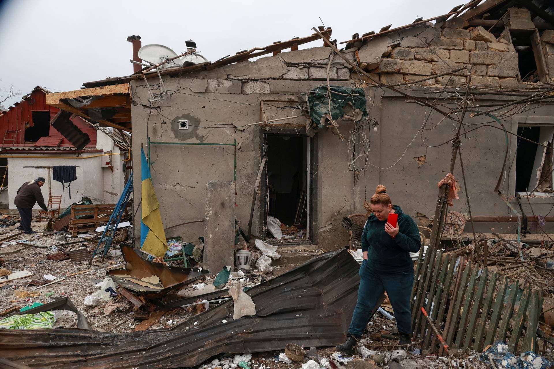 A resident stands next to his house heavily damaged by a Russian drone strike on the outskirts of Odesa