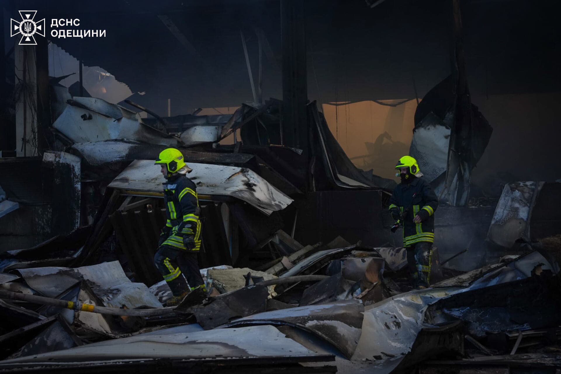 Firefighters work at a site of a Russian missile strike near Odesa