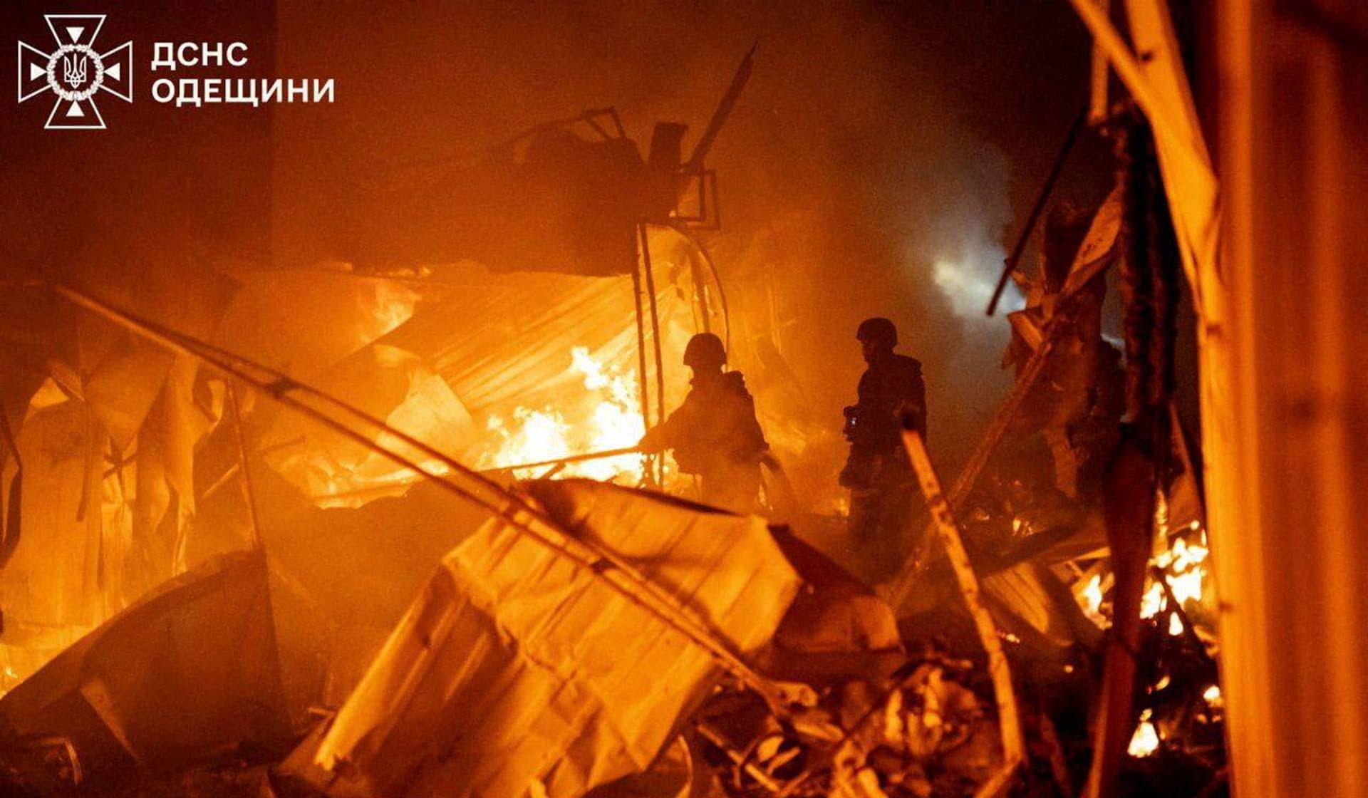 Firefighters work at the site of a Russian drone strike in Odesa