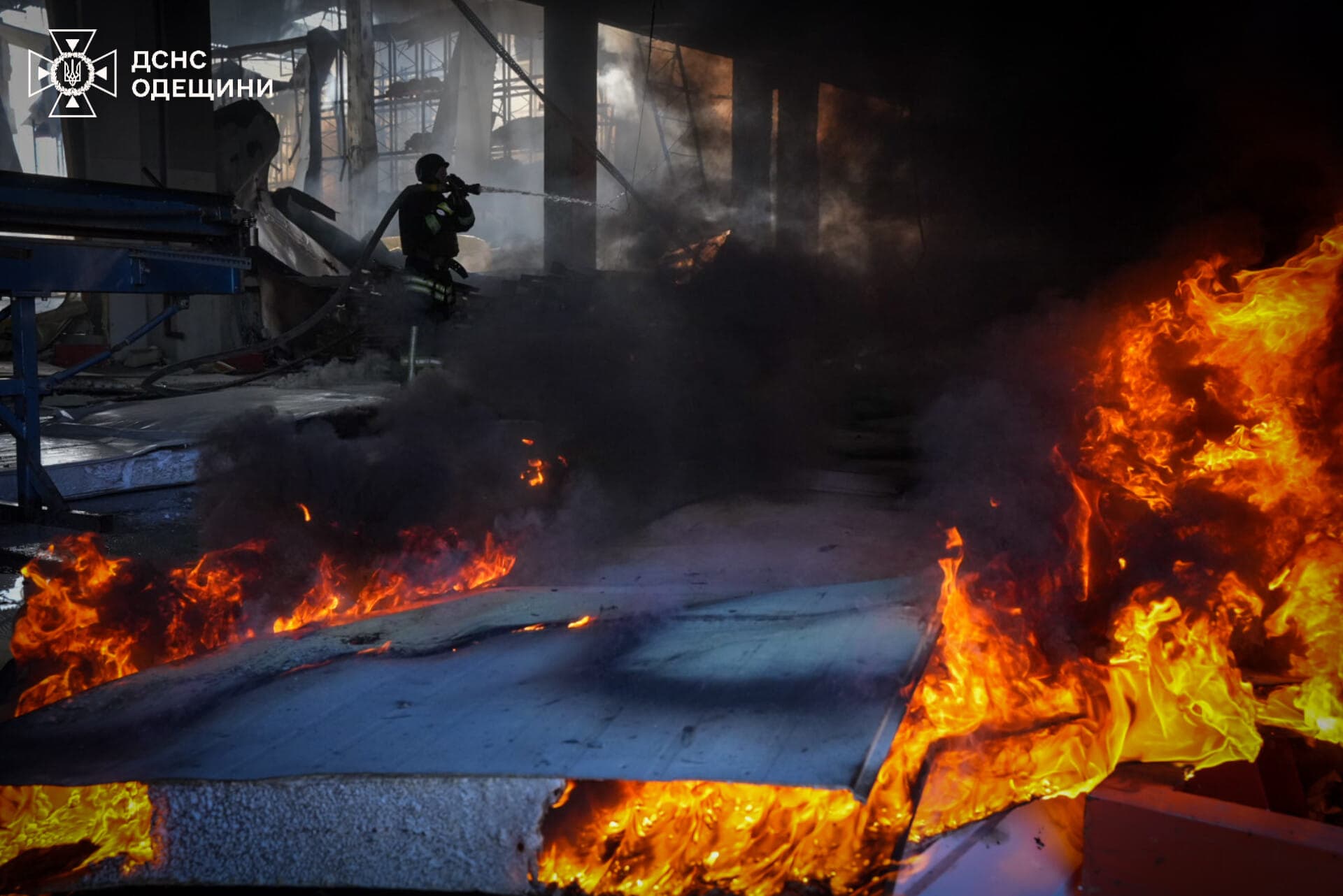 Firefighters work at a site of a Russian missile strike near Odesa