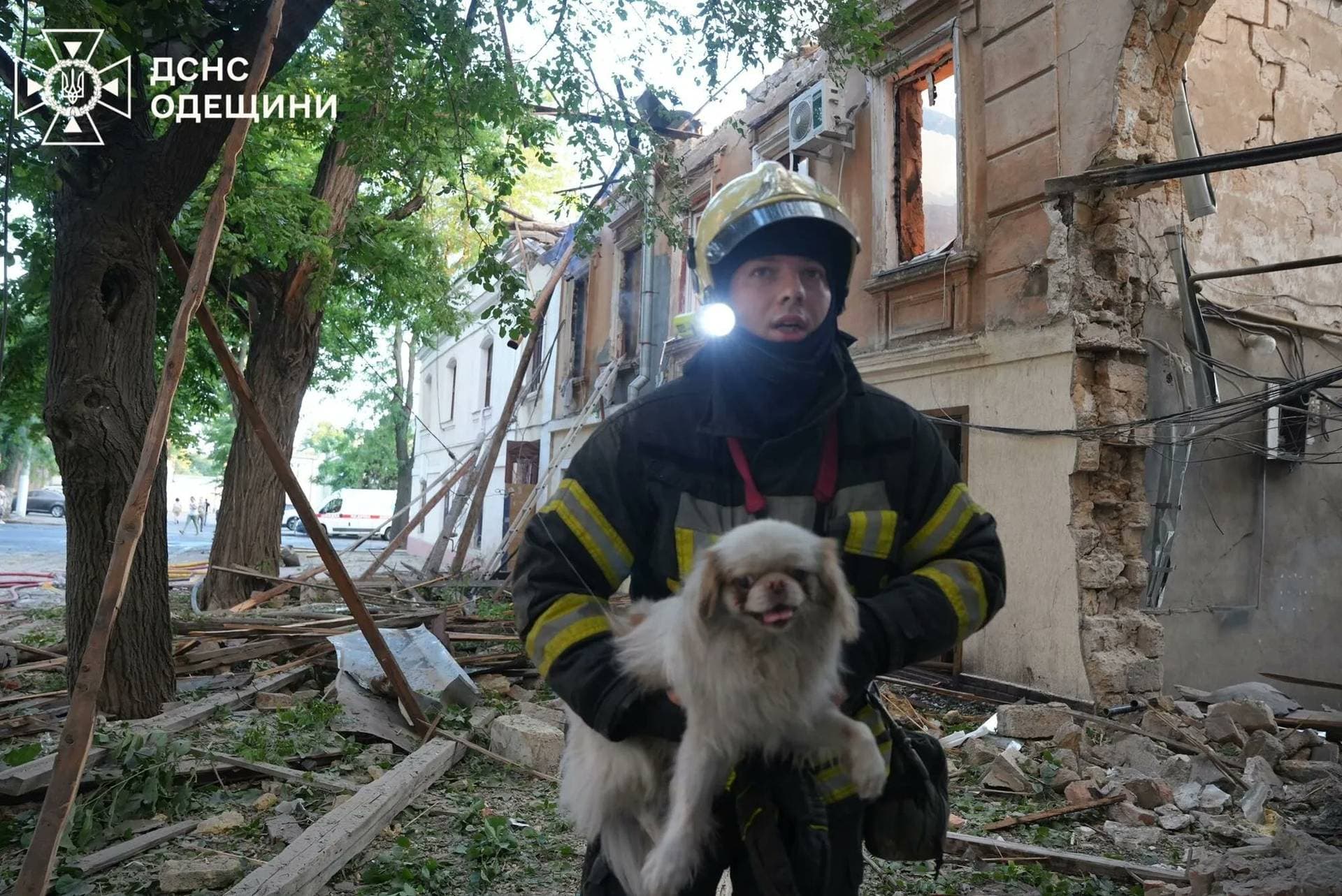 Residents leave the site of a Russian drone strike in Odesa