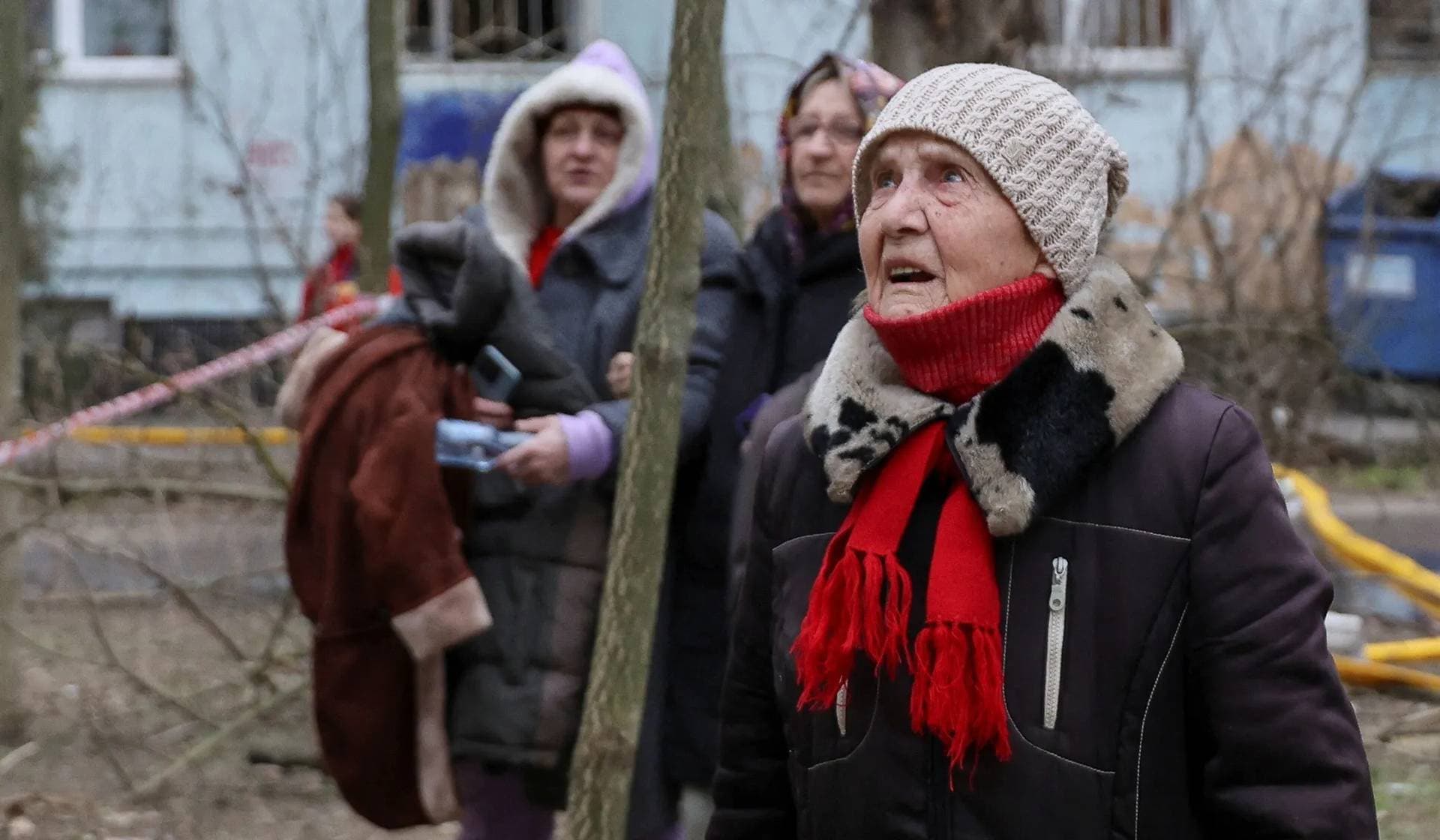 Residents look at their apartment building heavily damaged by a Russian drone strike in Odesa