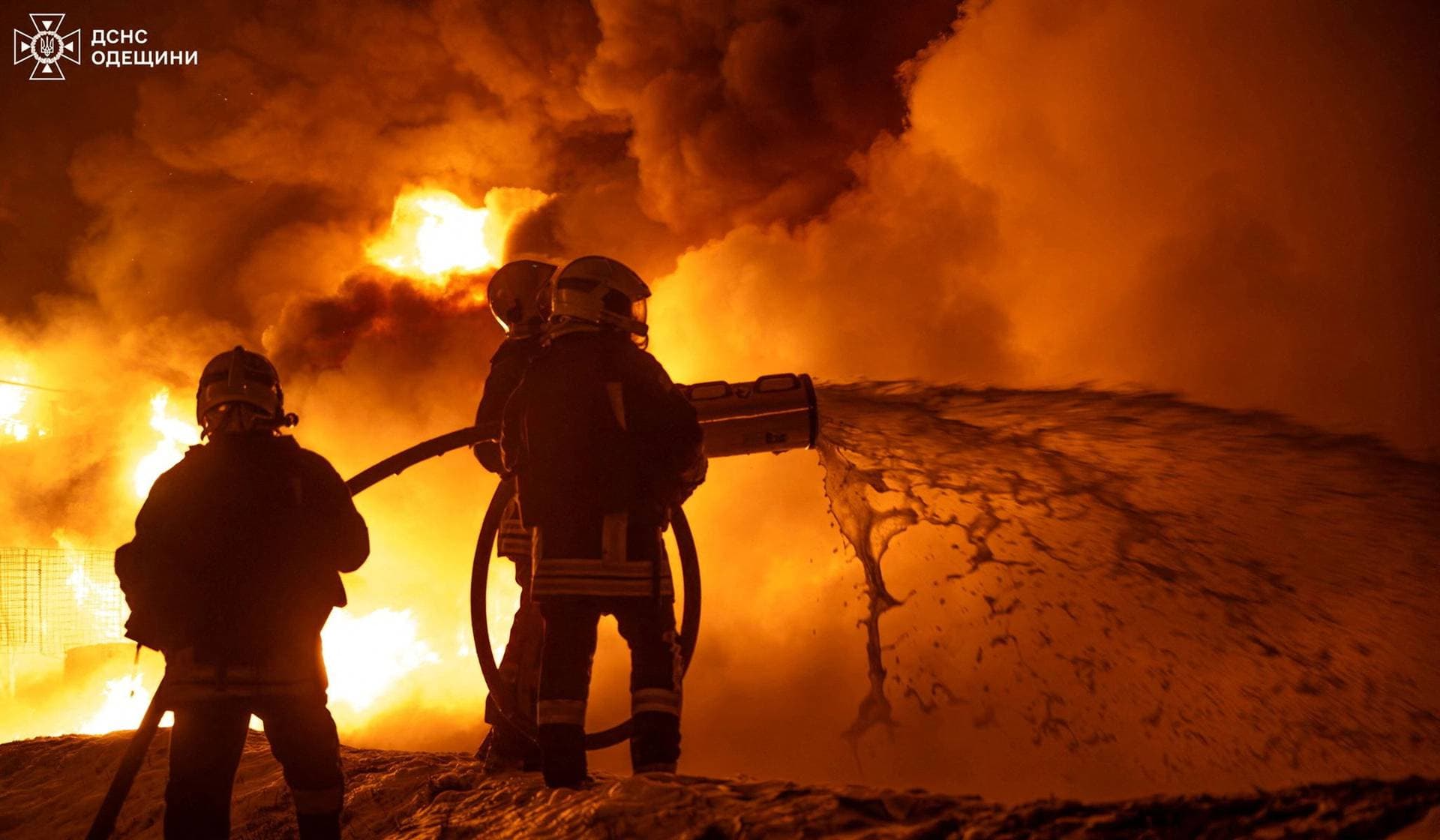 Firefighters work at the site of a railway infrastructure facility hit during overnight Russian drone strikes in Odesa