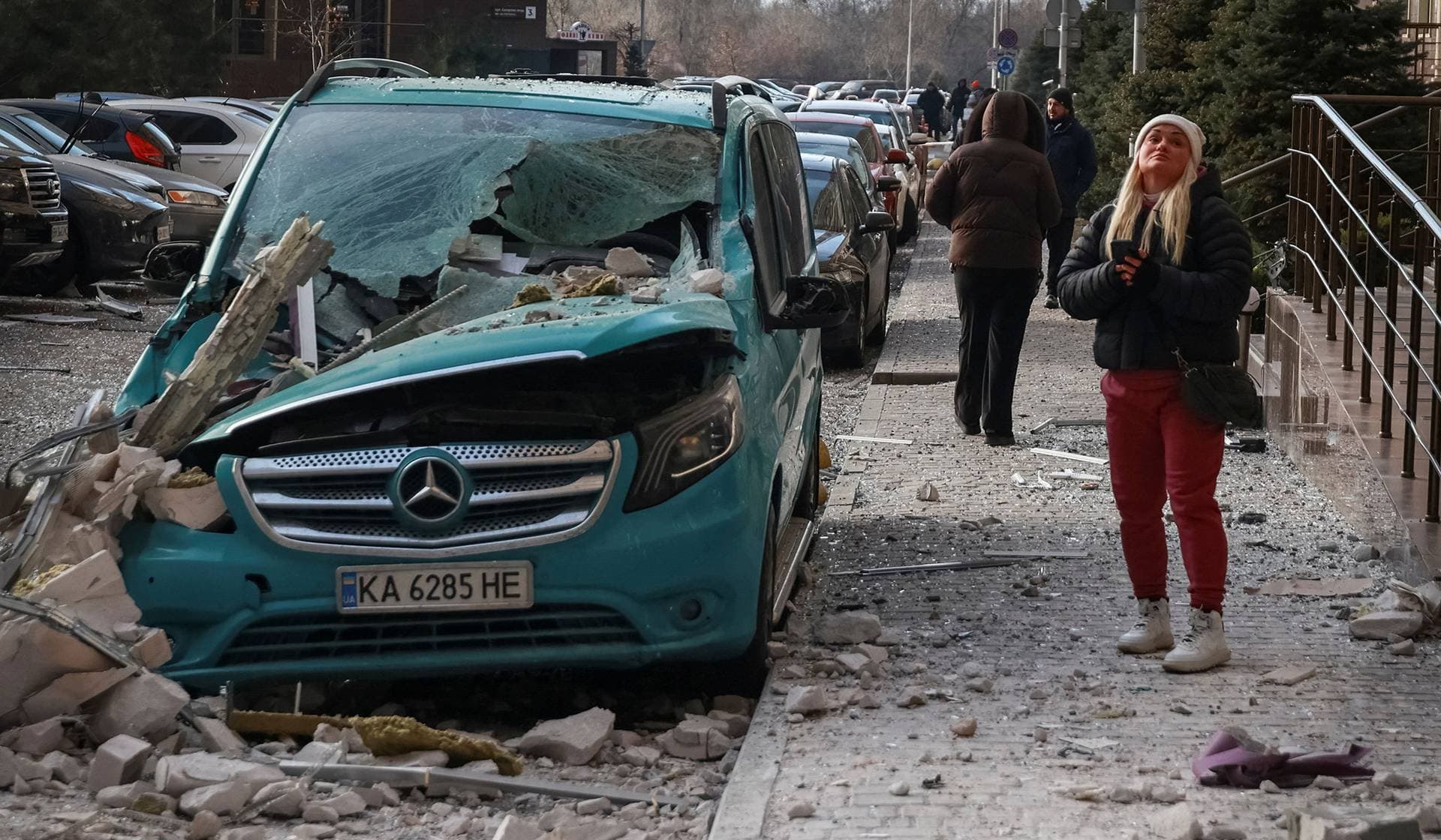 A resident stands at the site of the Russian drone strike in Odesa