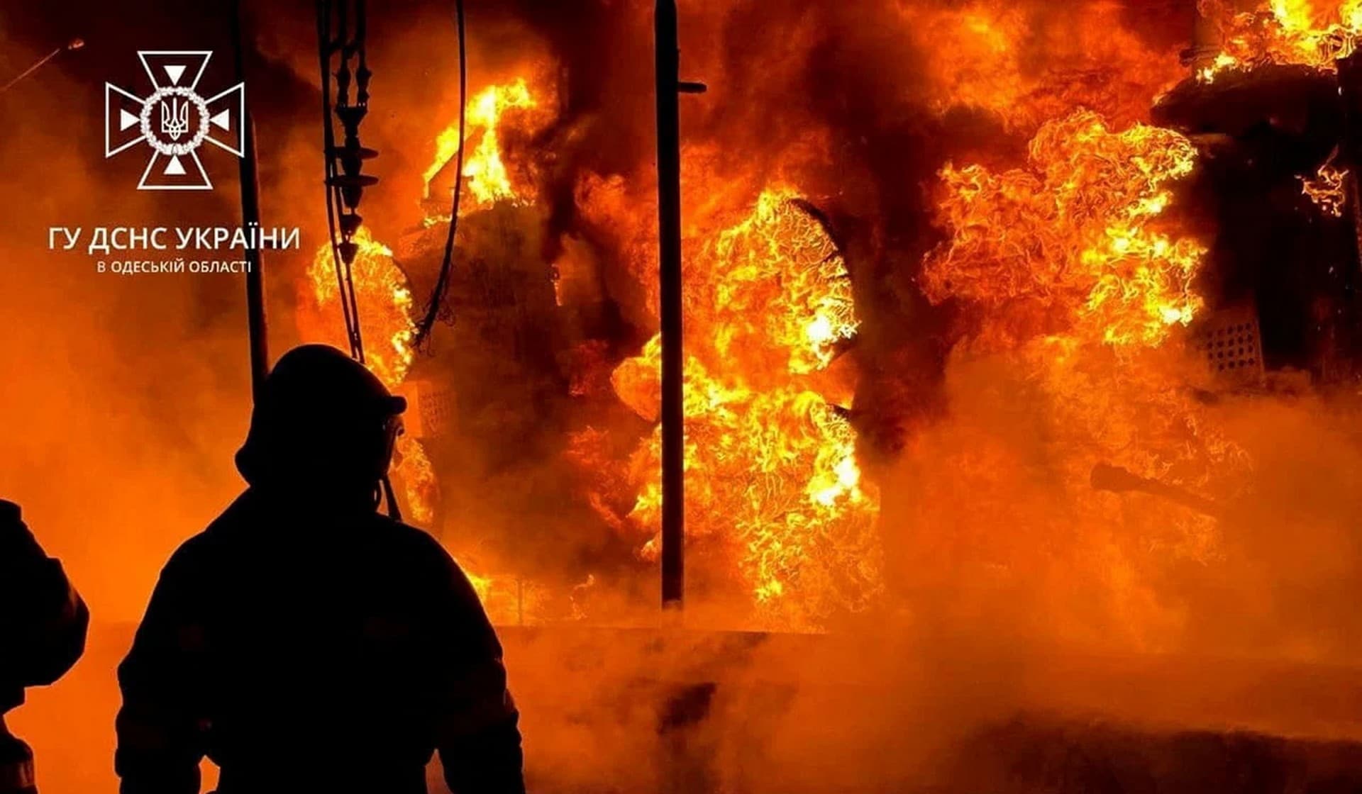 A firefighter works at a site of a critical power infrastructure object hit during Russian missile attacks in the Odesa Region