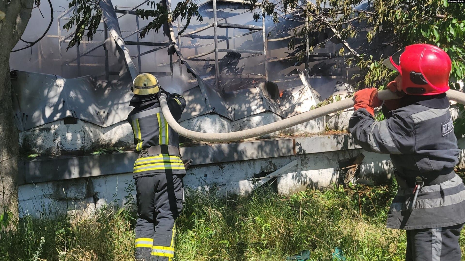 Firefighters extinguish a blaze at a logistics hub after a Russian missile strike on Odesa