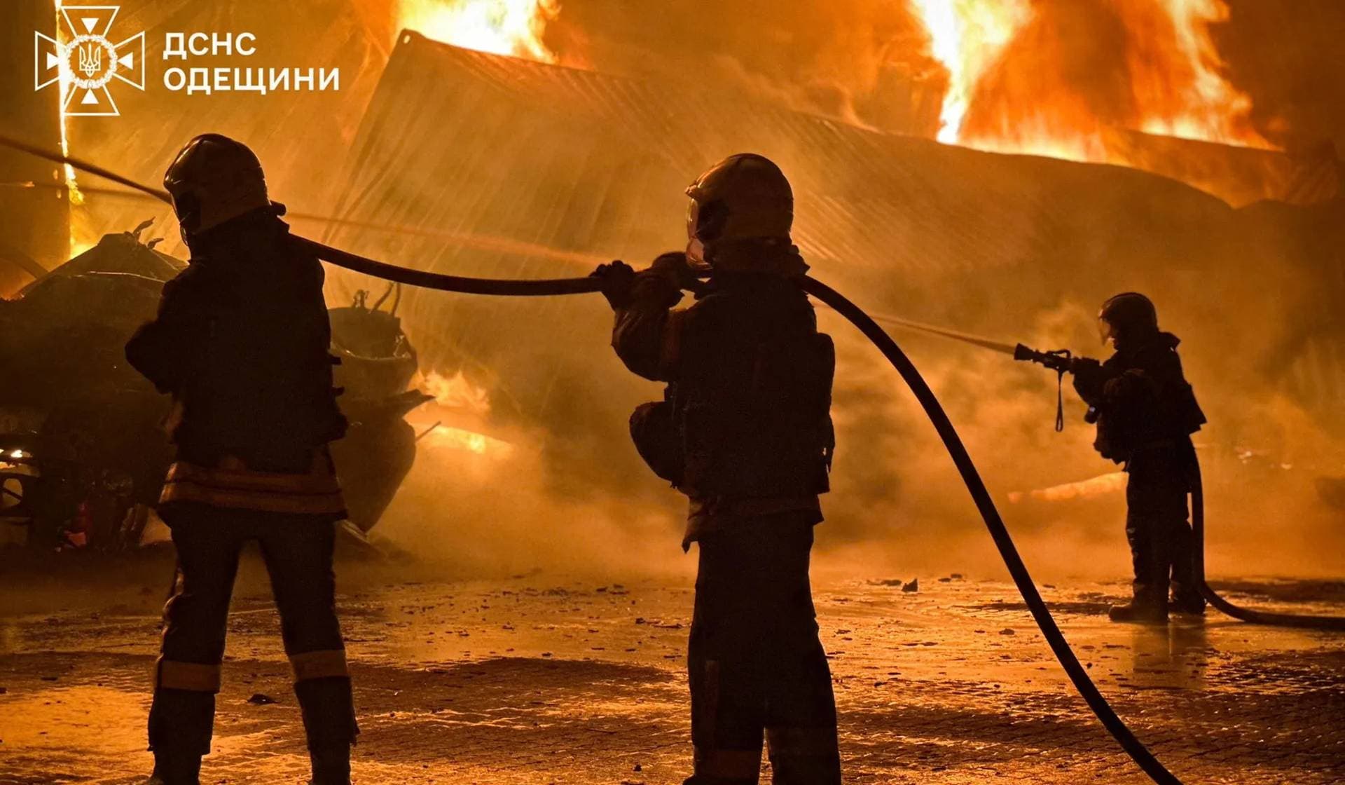 Firefighters work at the site of a Russian drone strike in Odesa Region