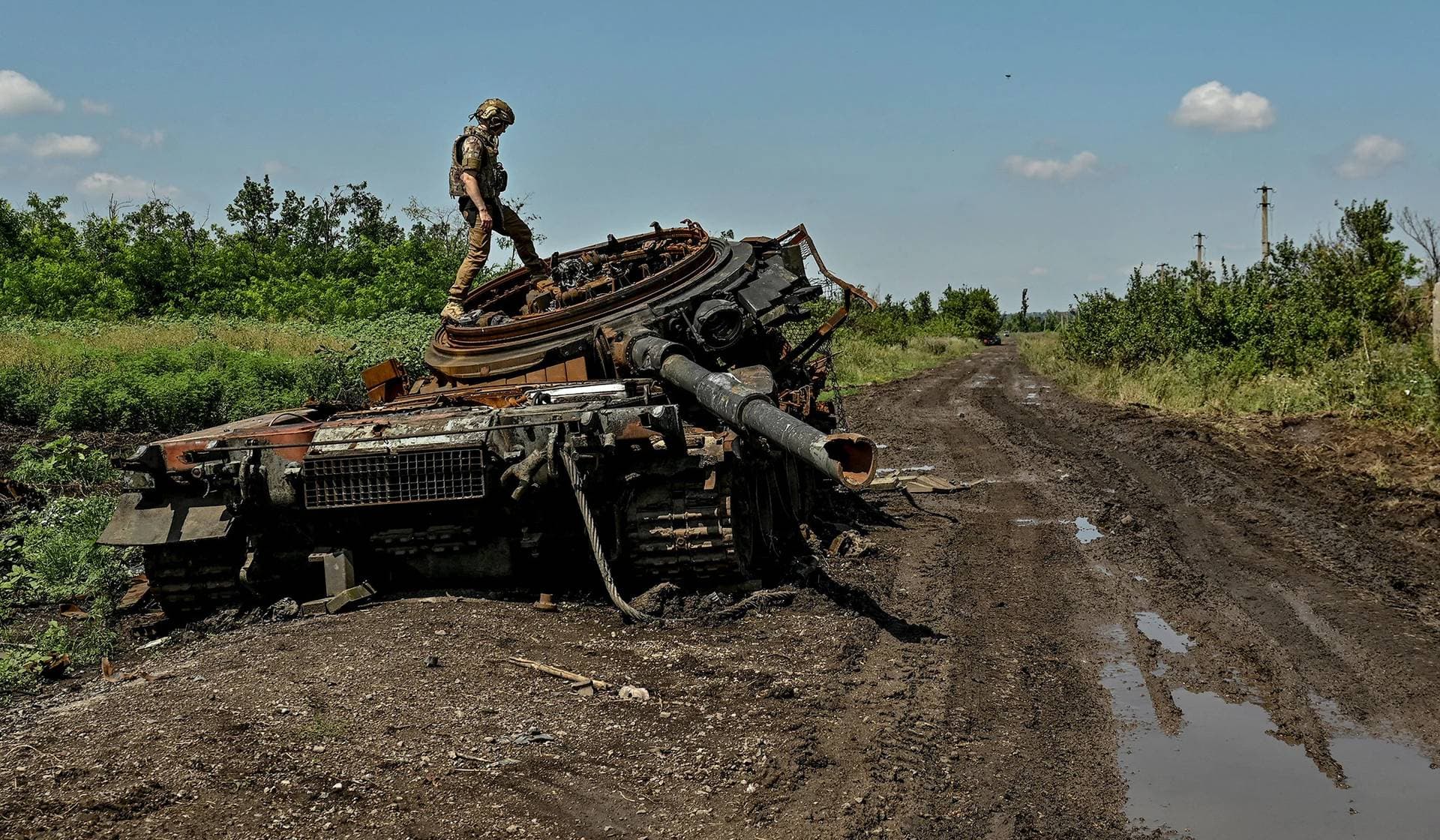 A destroyed Russian tank in the recently liberated village of Novodarivka