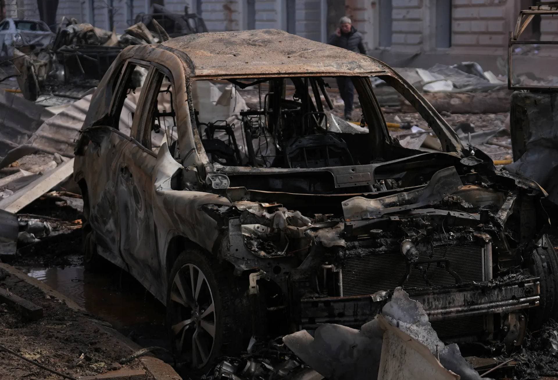 Damaged vehicles at the site of Russian missile strike in Sumy