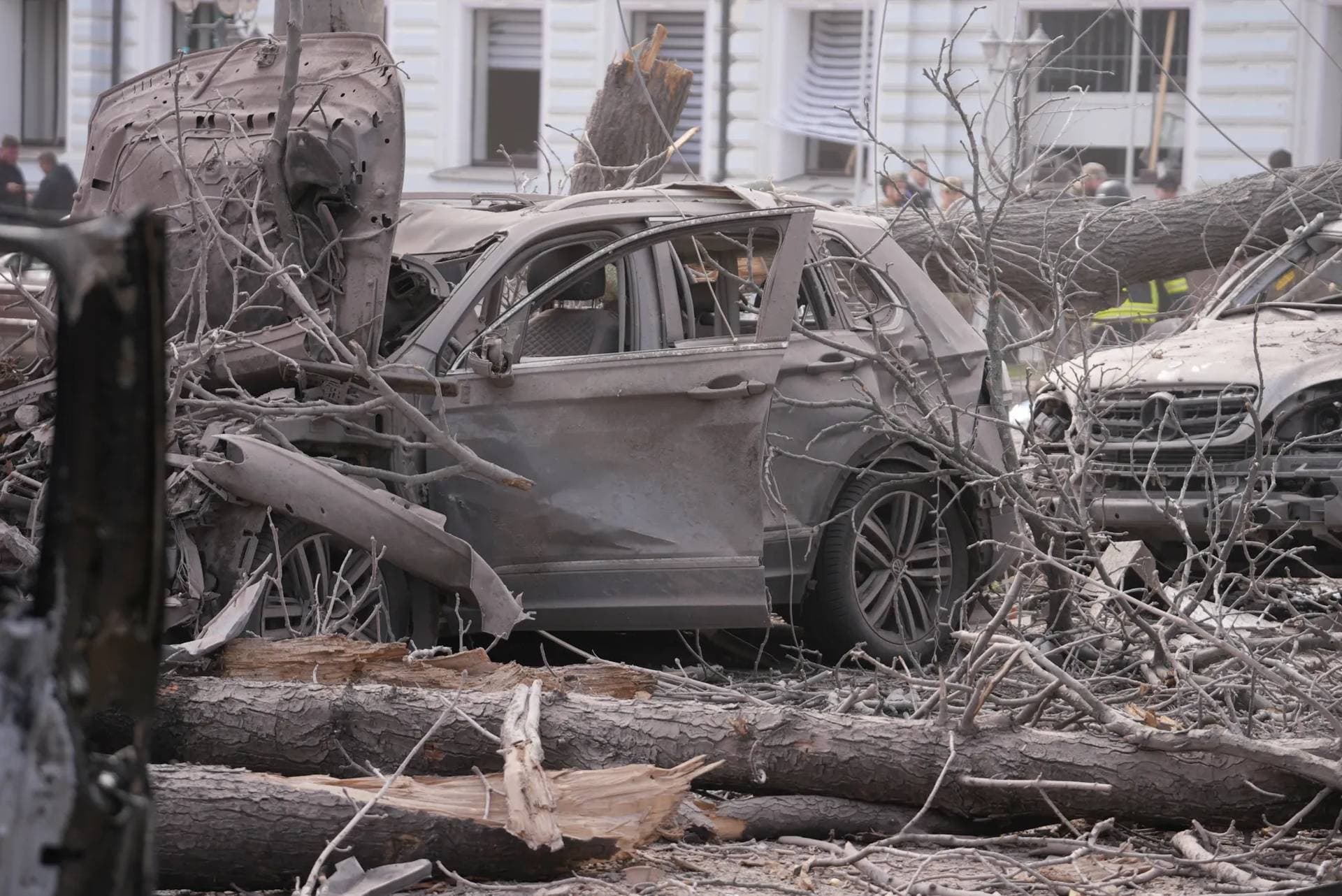 Damaged vehicles at the site of Russian missile strike in Sumy