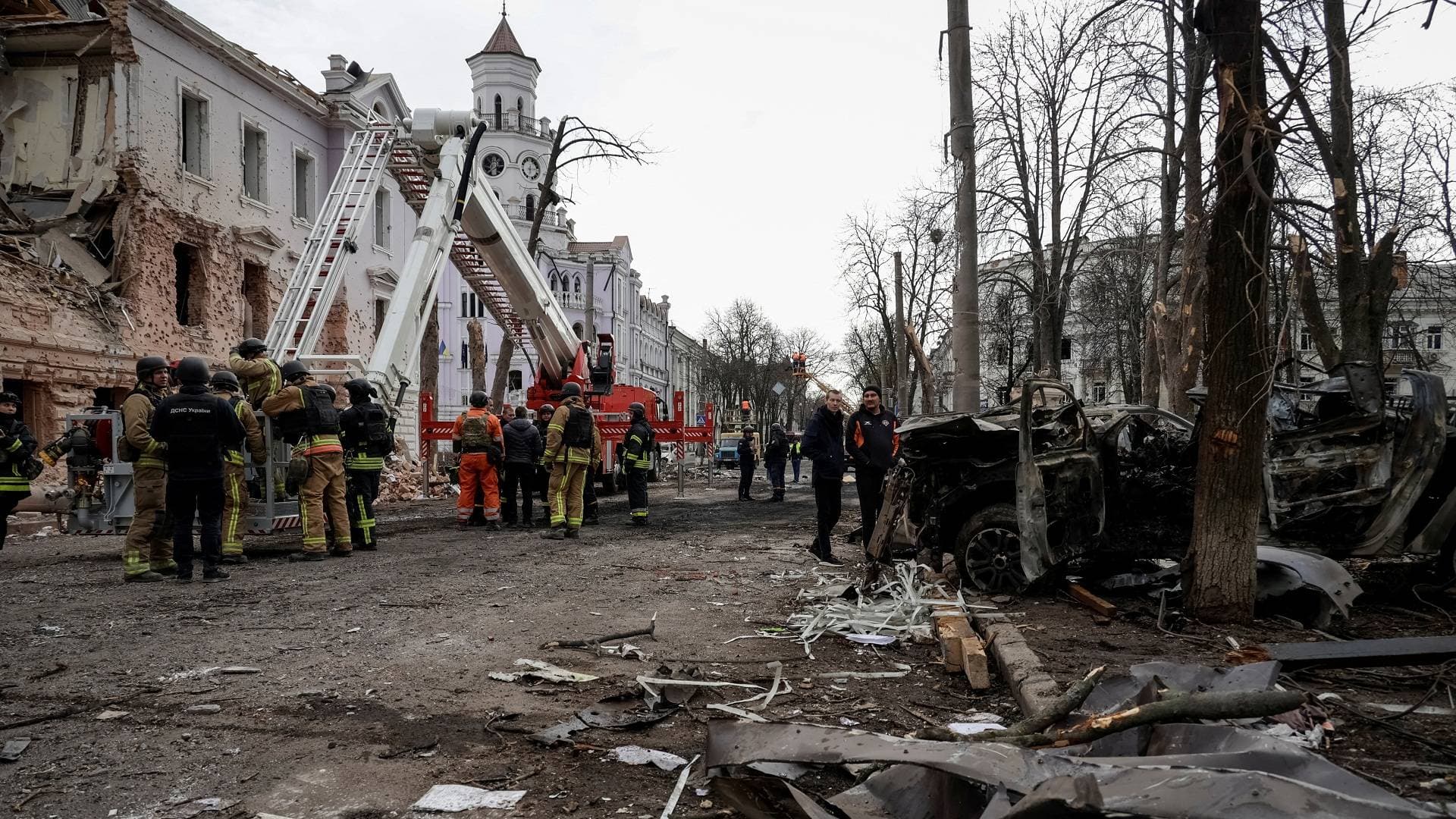 Members of emergency services work at the site of a Russian missile strike in Sumy