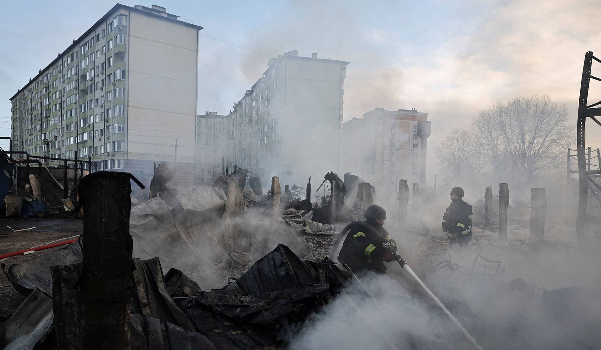 Emergency responders work at the site of a warehouse that was struck during a night of Russian missile and drone strikes in Novi Petrivtsi